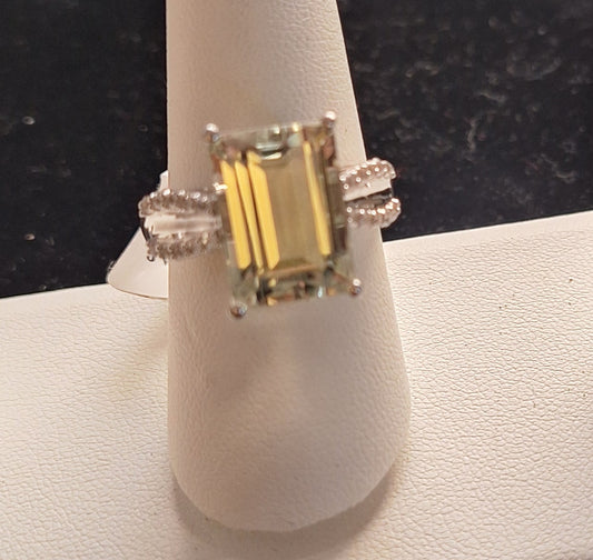 8.00CT Emerald Cut Brazilian Prasiolite with .31CTW Round White Topaz