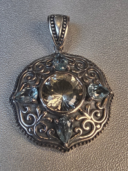 925 Sterling Silver Pendant featuring a central labradorite gemstone surrounded by blue topaz accents and intricate scrollwork