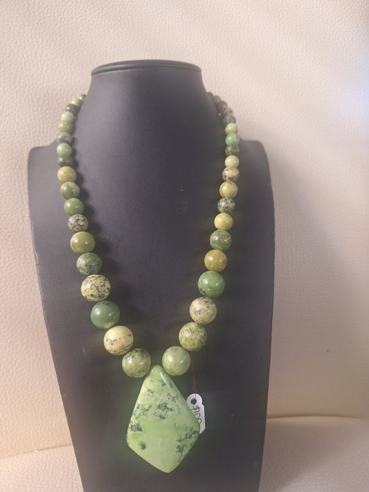Green Turquoise Necklace and Diamond shaped Pendant with a Sterling Silver 925 Chain Closure.